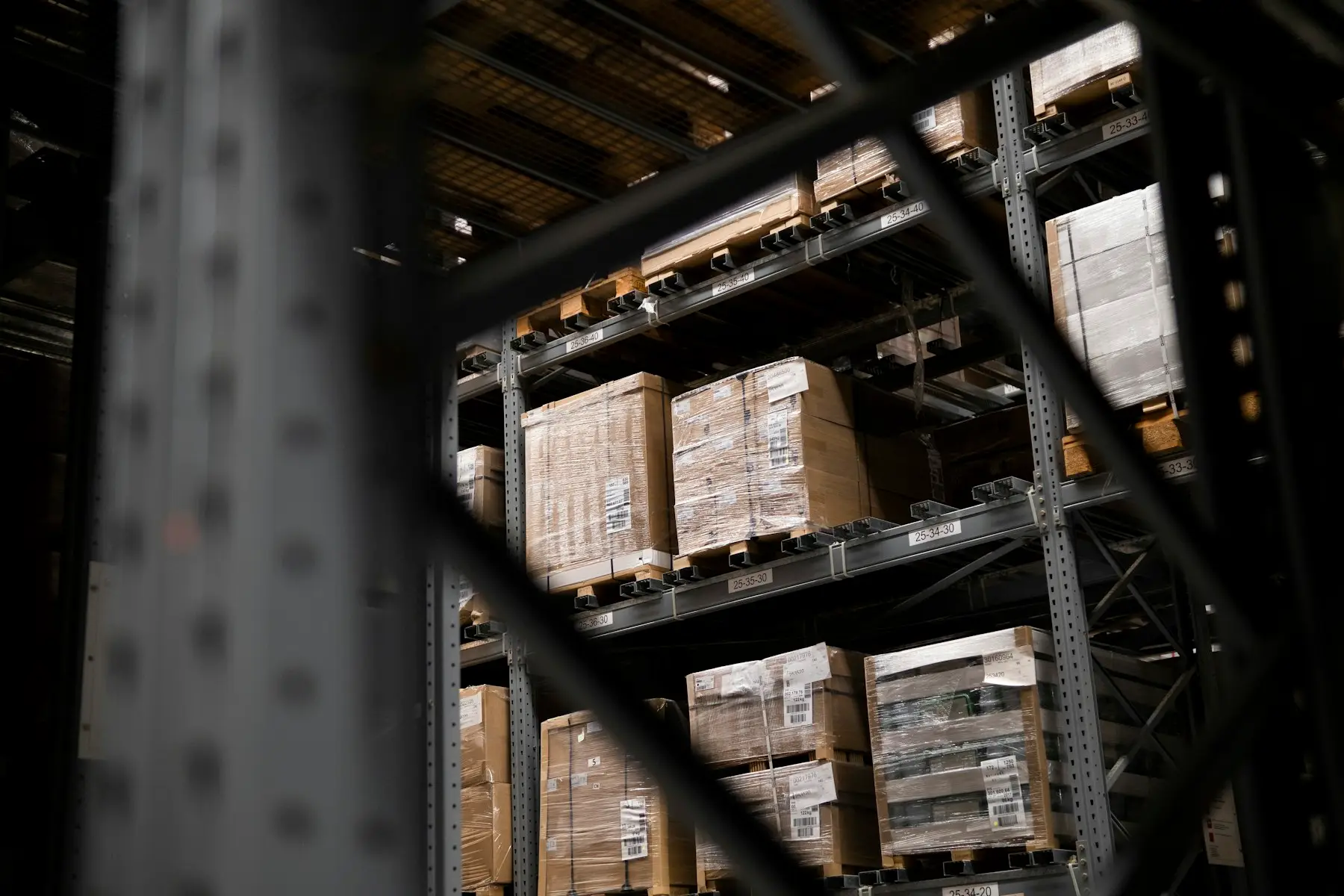 Palletised stock stored on high warehouse racking